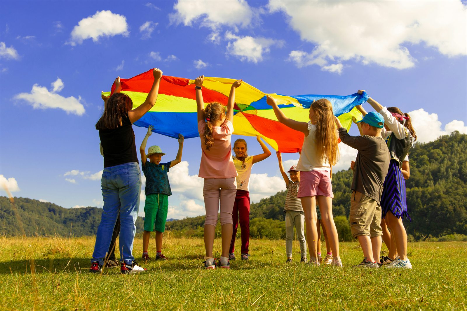 Children playing together outdoors during a community activity